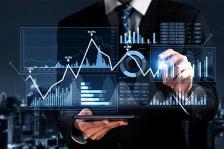 Business person uses a tablet with digital sales charts and data visualisations