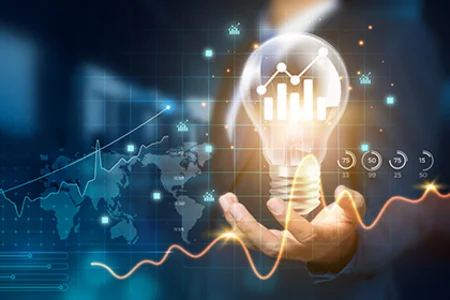 Man holding light bulb with data visualisations and diagrams relating to business intelligence