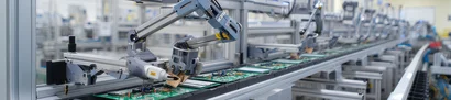 Consistent series production with our ERP industry solution unitop Automated electronics manufacturing with multiple robotic arms on a mass production line
